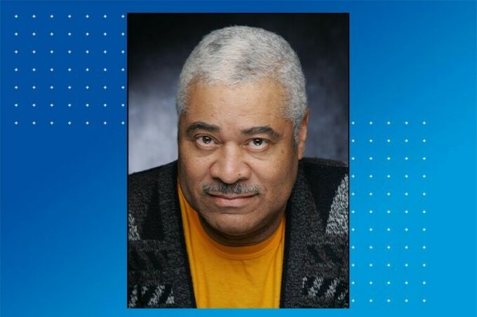 Head shot of an older black man with grey hair and moustache