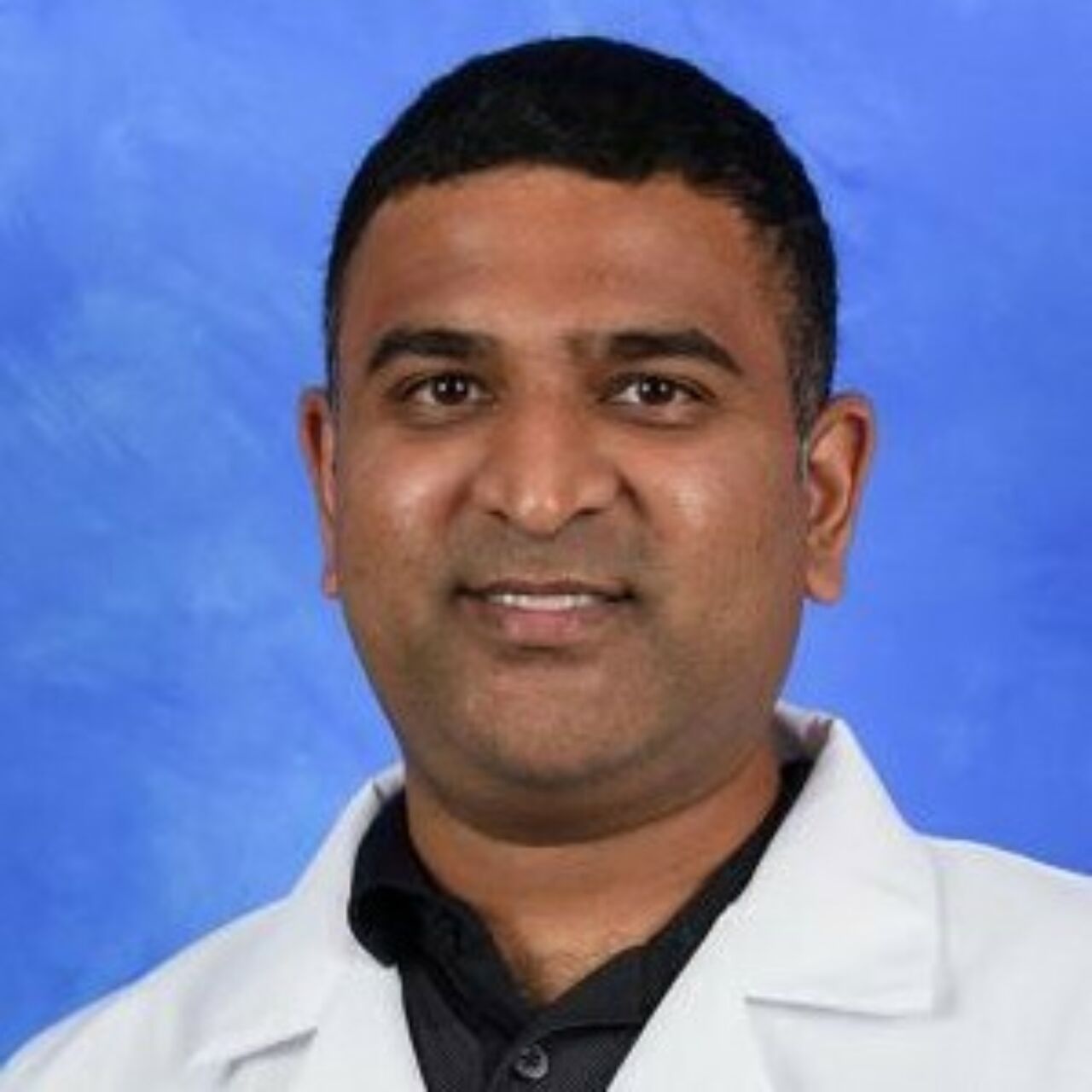 Professional headshot of Dr. Ravishankar Rao, a medical liaison to Penn State Musical Theatre serving as a point of access for general health and performance related health conditions.