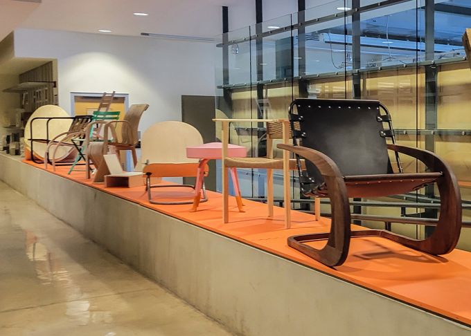 Chairs crafted by Stuckeman School students, faculty, and alumni align a section of the first floor of the Stuckeman Family Building.