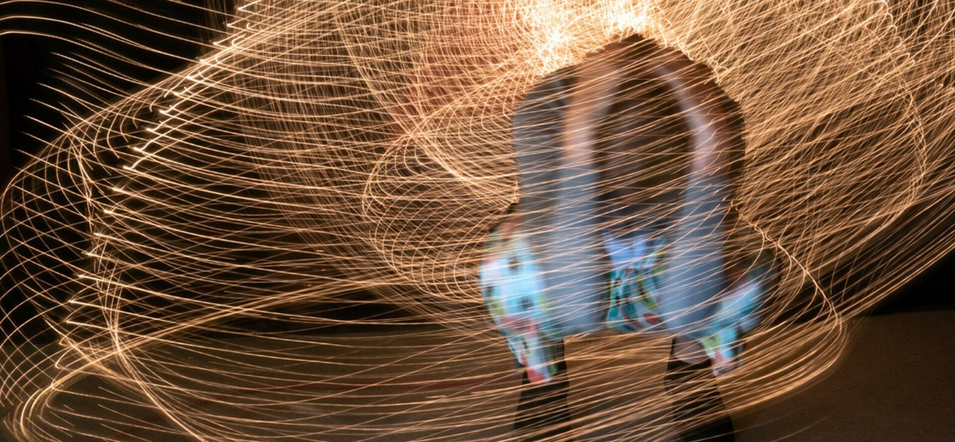 An interactive exhibition at the Woskob gallery of a participant creating unique spatial design with light painting.