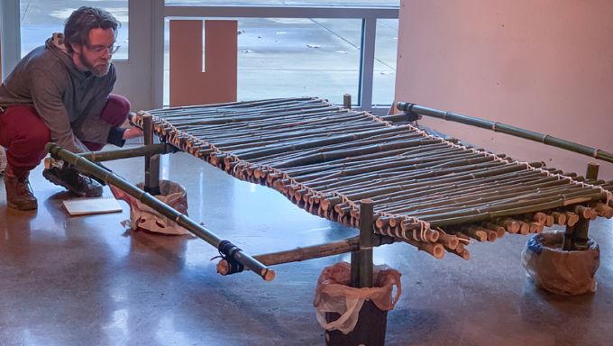 LARCH student finalizing the design of a bamboo walkway