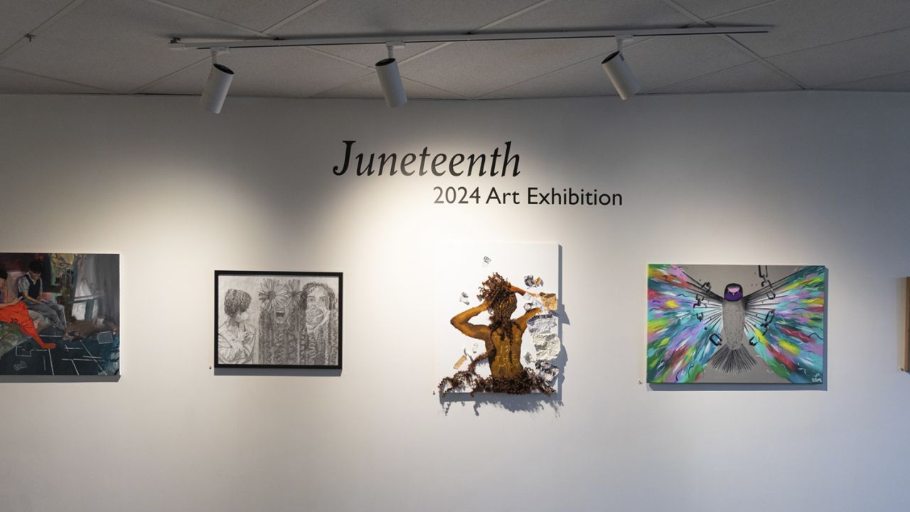 Five works of paintings and illustrations on display on a gallery wall.