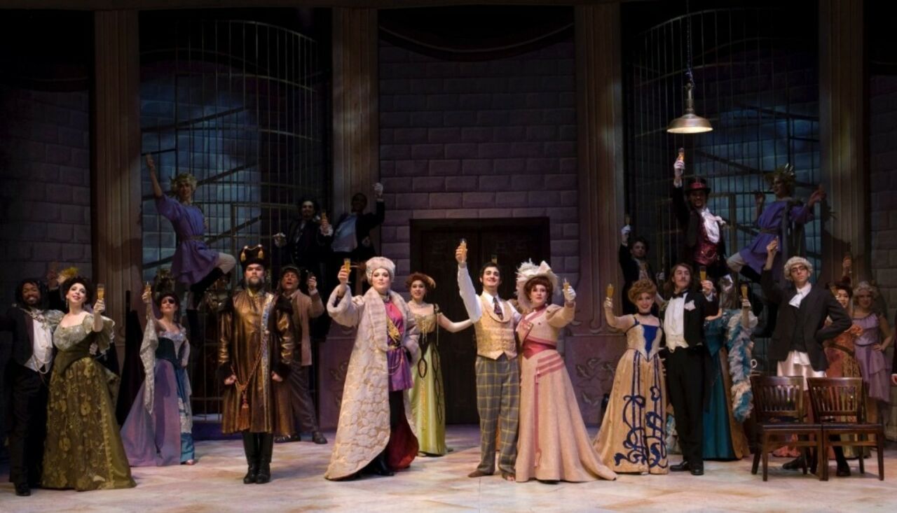 The cast of Penn State Opera Theatre's "Die Fledermaus" toasting the audience on stage.