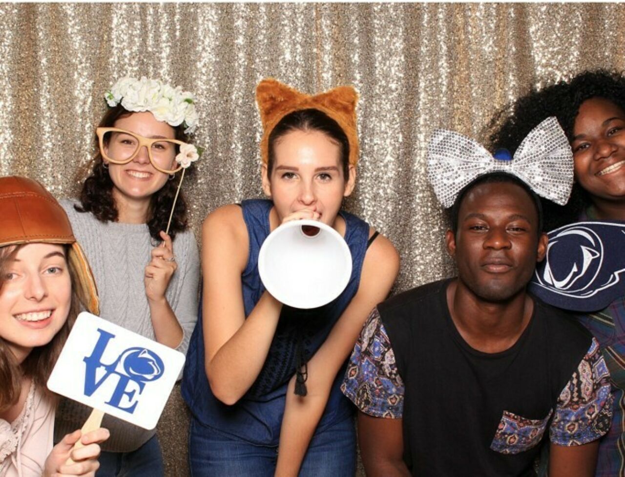 Five students posing in a photo booth at a start-of-semester welcome back event in the Stuckeman School.