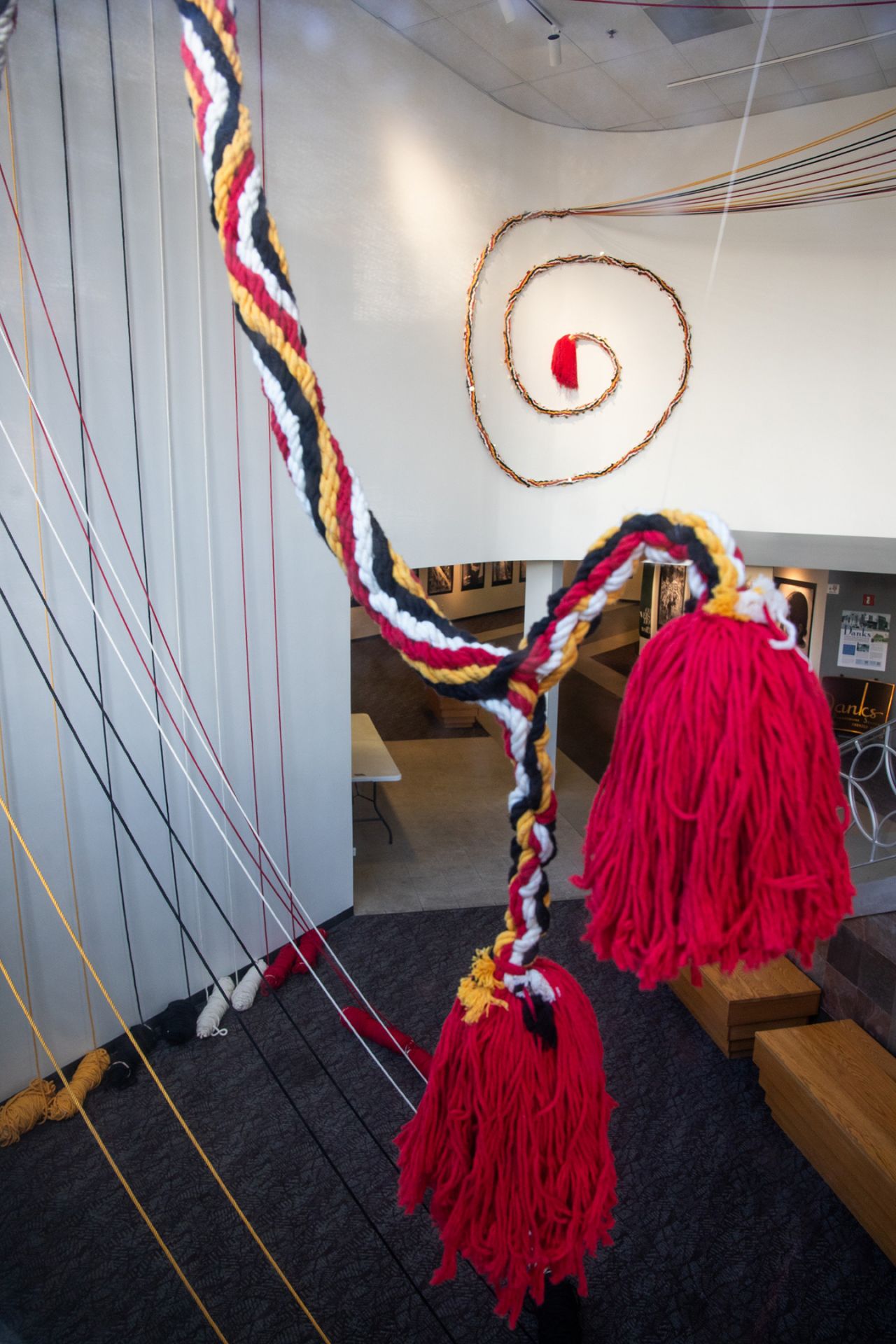 A braided Inca rope suspended by string, on display in the Woskob Family Gallery.