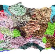 Textile art consisting of many different types of fabric.