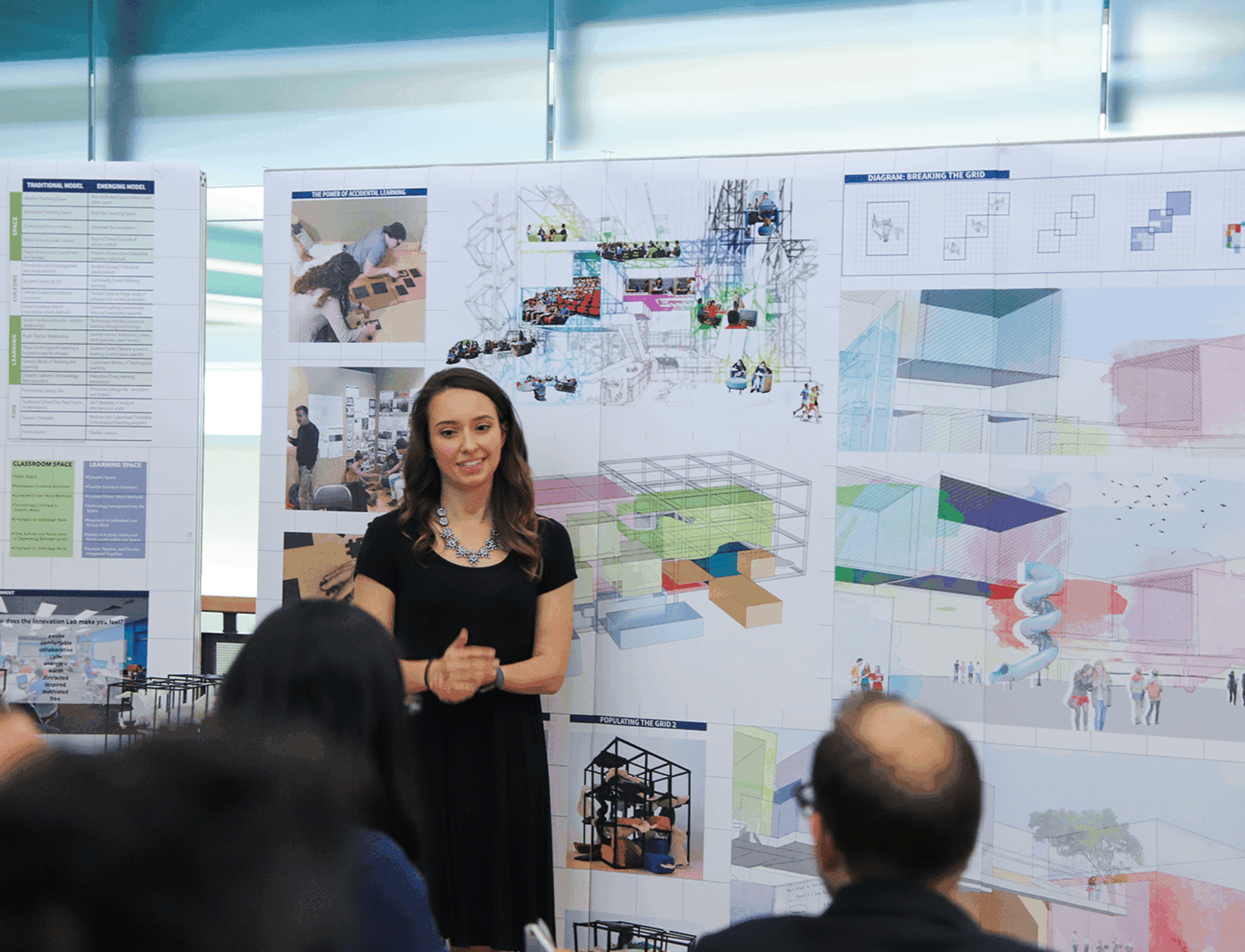 A fifth-year architecture student presents her thesis to a jury.