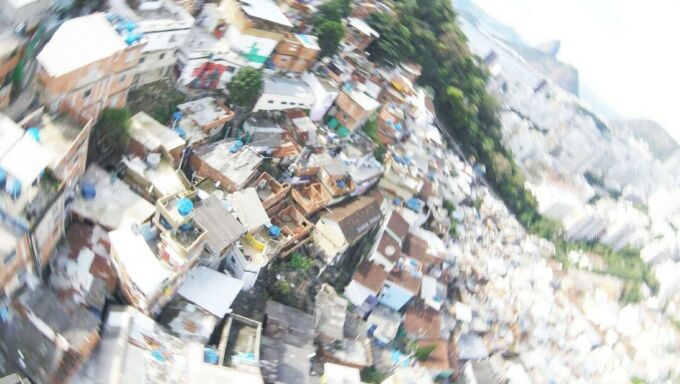 Radially blurred aerial view of favelas in Rio de Janeiro's Santa Marts hill region.