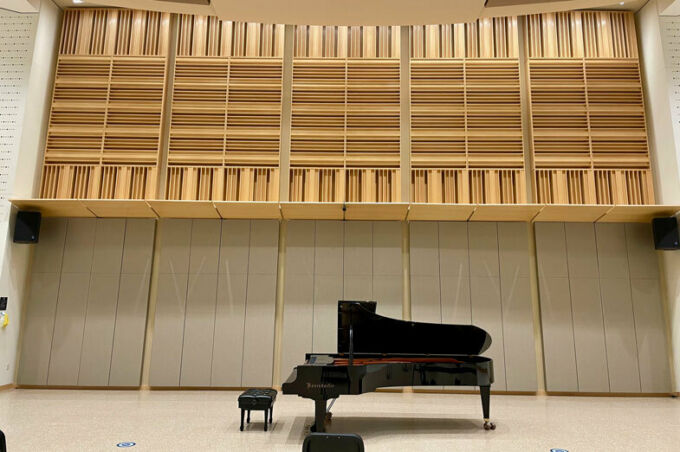 concert grand piano beneath acoustic baffling in Esber Rehearsal Hall