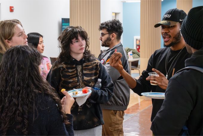 Students conversing after the Mending Walls documentary screening