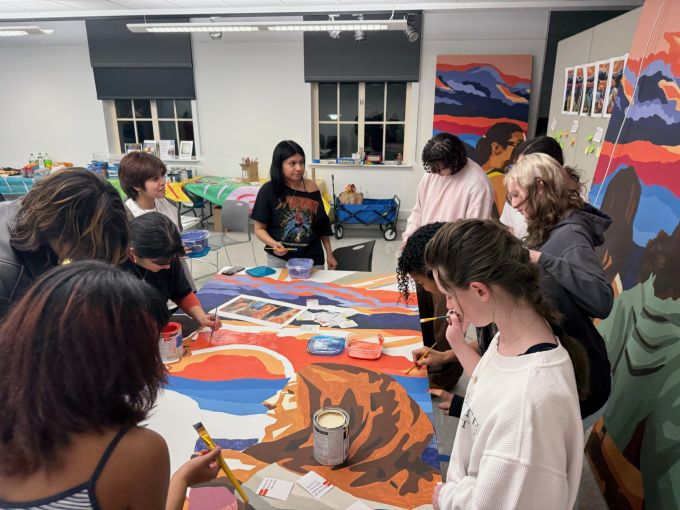 Students working on the 2025 Mending Walls Penn State Mural during a Painting & Talking Session.