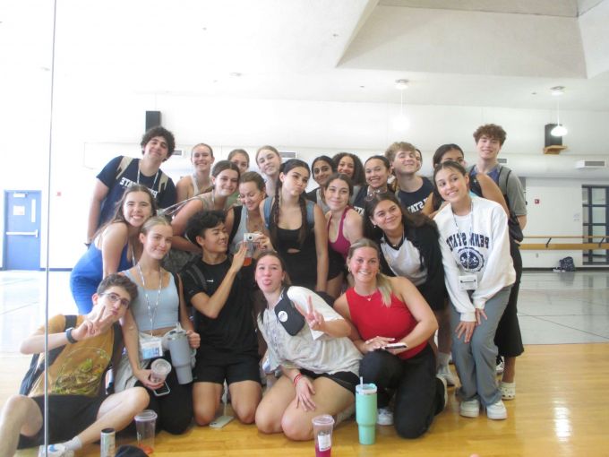 Group of summer theatre students participating in the STATE Musical Theatre training program, take a break from class and pose in the mirror for a photograph.