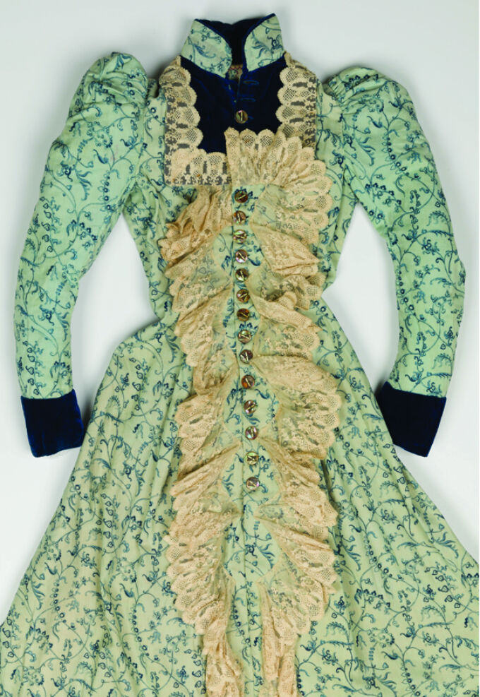 Formal dress in green and gold fabrics that is part of a Theatrical costume archive.
