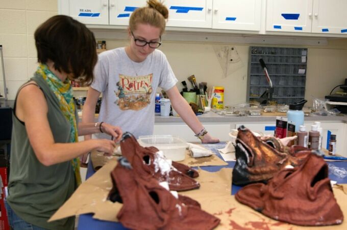 Students creating multiple masks for a School of Theatre production.
