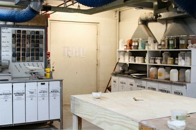 The fully stocked glaze room in the SoVA Ceramics Studio with extensive material inventory.