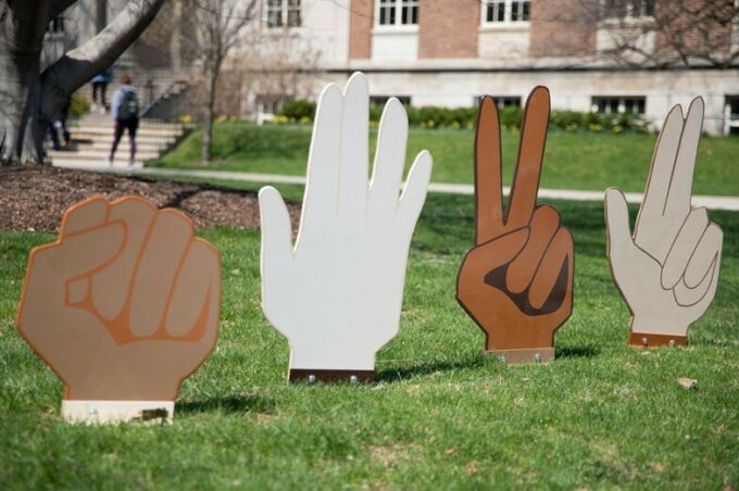SoVA student artwork of an outdoor sculpture of four hands signing a word.