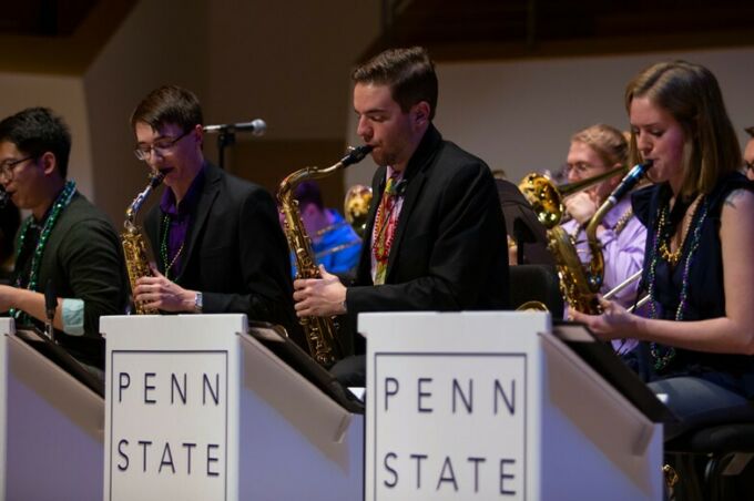 A group of the Penn State Jazz band perform their saxaphones during the Mardi Gras concert.