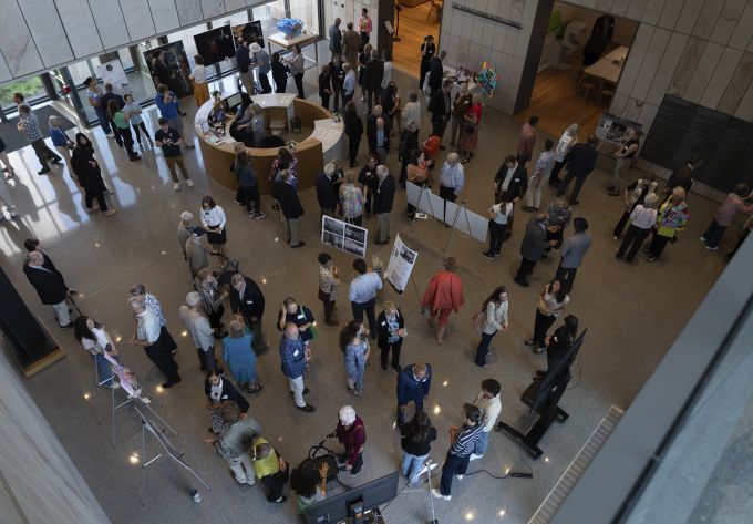 Overhead shot of event attendees in the Palmer Museum of Art's lobby.