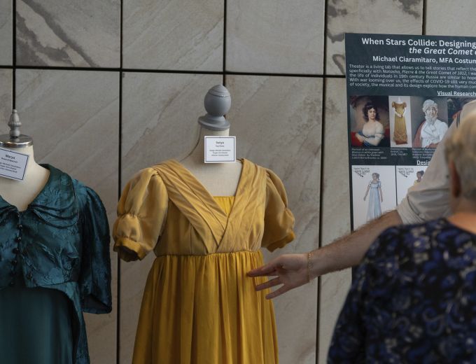 Two dresses from the School of Theatre on display.