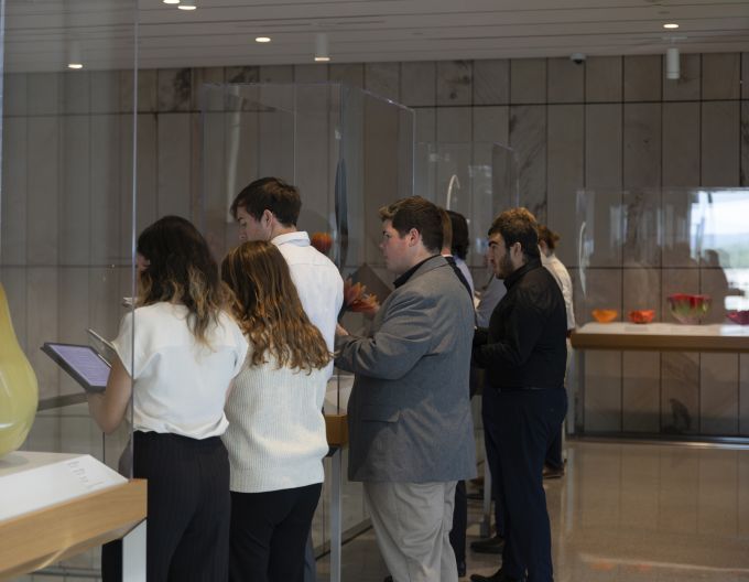 A group of choir singers performing in the new Palmer Museum of Art.