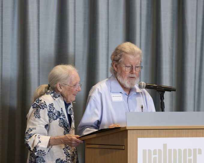 Two donors speaking at the podium.