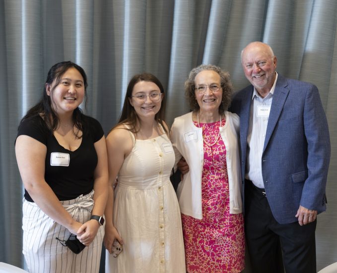 Group photo of two A&A students smiling next to two donors.