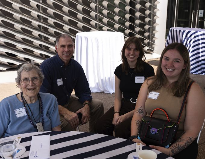 Group photo of two A&A students with two donors.