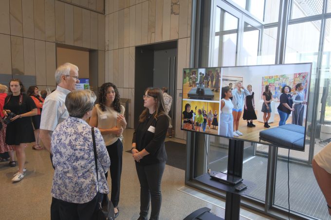 Donor Appreciation attendees socializing with a couple of A&A students in the new Palmer Museum of Art's Dr. Keiko Miwa Ross Lobby.