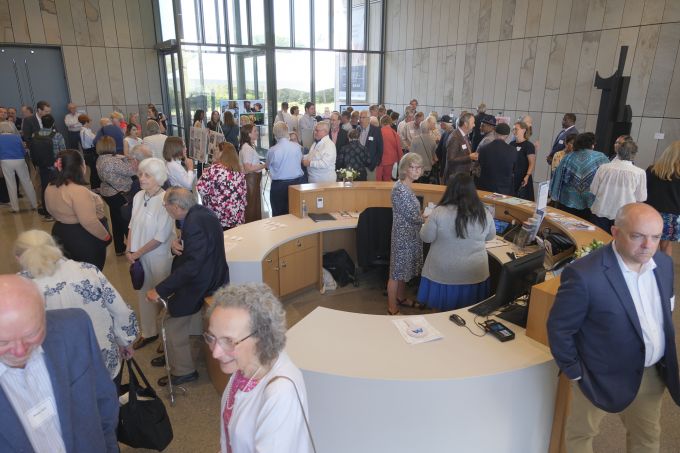 Donor Appreciation attendees socializing in the new Palmer Museum of Art's Dr. Keiko Miwa Ross Lobby.