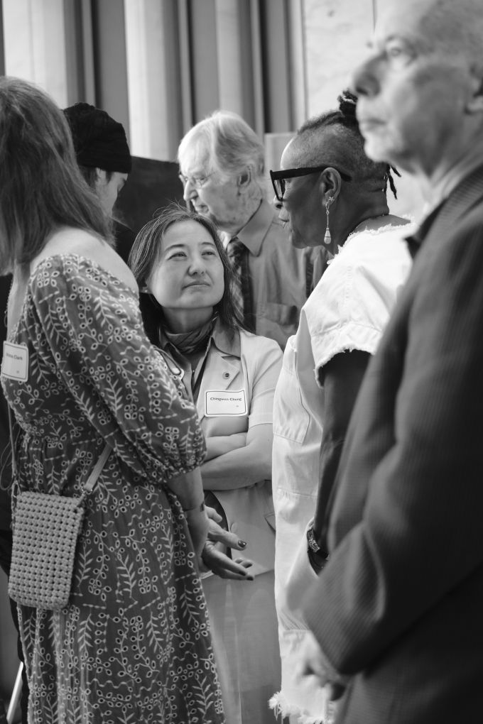 Chingwen Cheng (center) conversing with Folayemi Wilson (right).