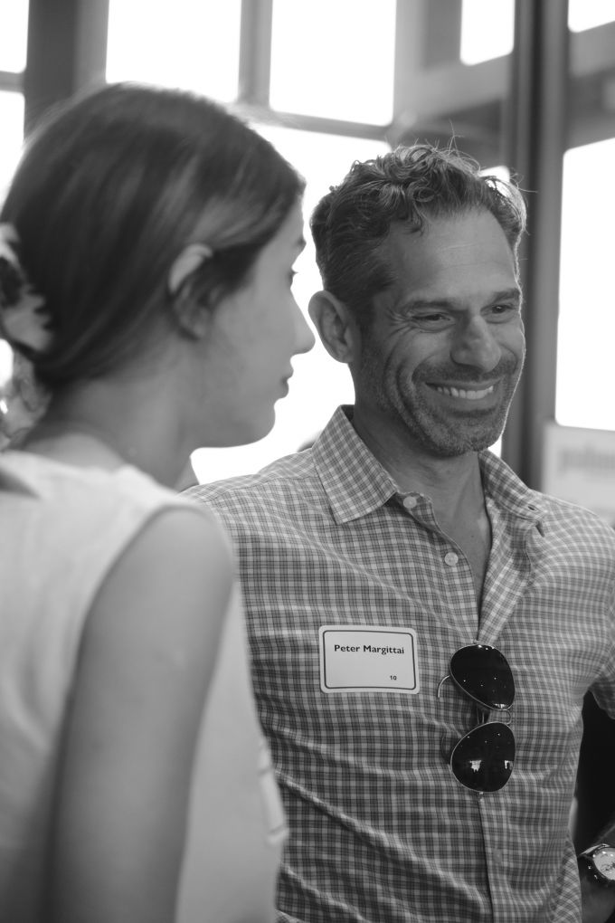 Peter Margittai smiling while standing to the right of a female attendee.