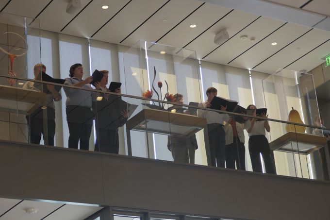 School of Music choir singers performing in the new Palmer Museum of Art