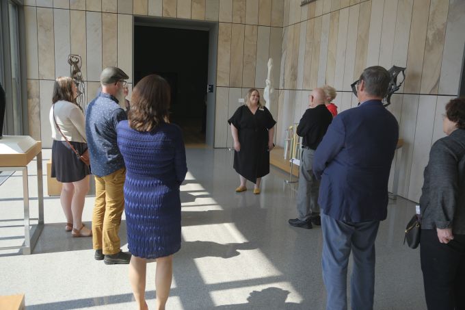 A group of people touring the new Palmer Museum of Art.