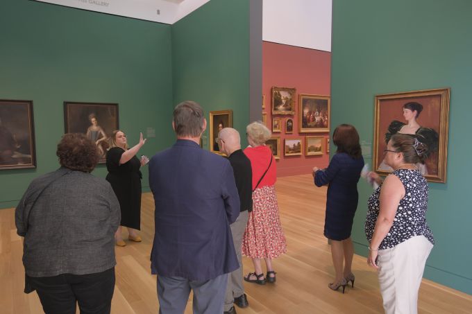 A group of people touring the new Palmer Museum of Art.