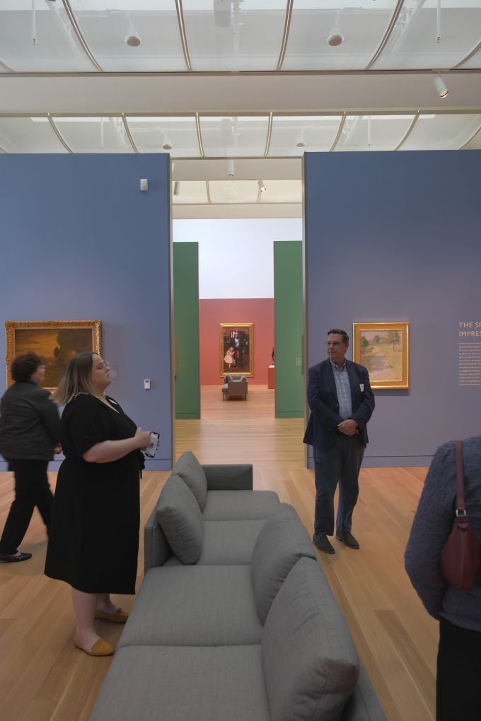 A group of people touring the new Palmer Museum of Art.