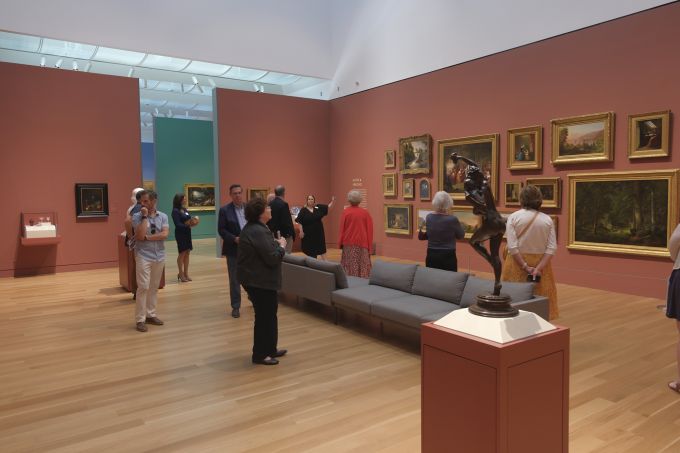 A group of people touring the new Palmer Museum of Art.