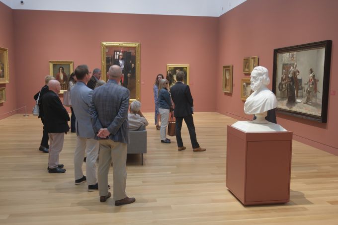 A group of people touring the new Palmer Museum of Art.