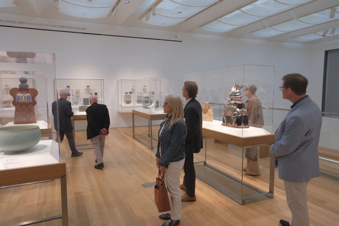 A group of people touring the new Palmer Museum of Art.