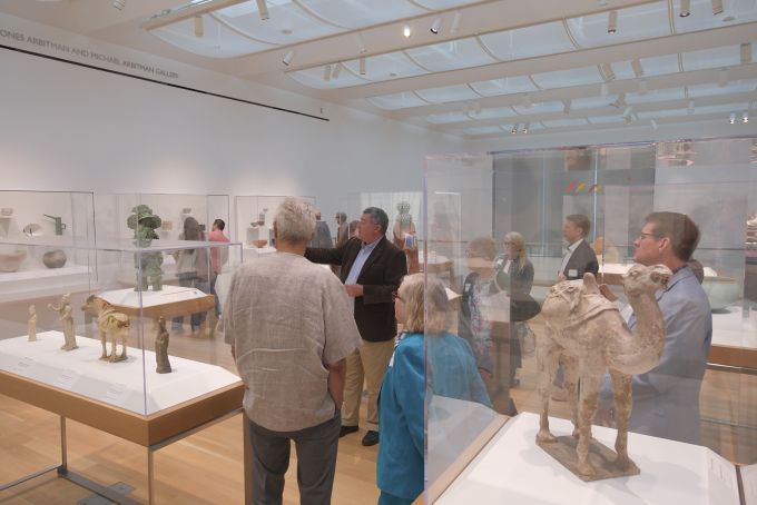 A group of people touring the new Palmer Museum of Art.