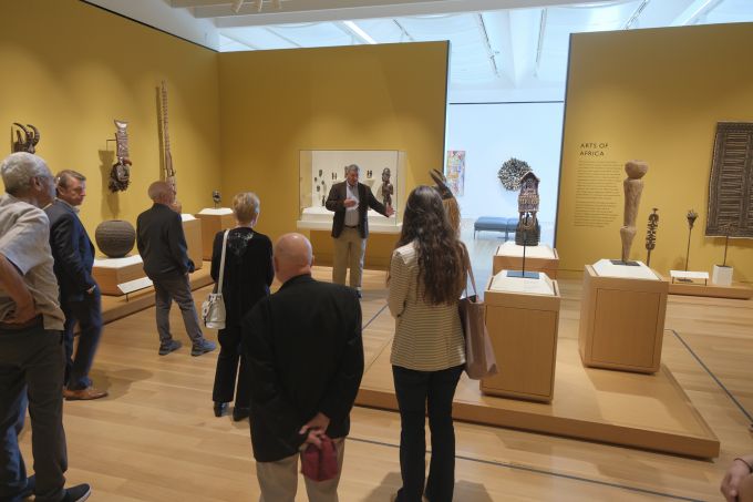 A group of people touring the new Palmer Museum of Art.