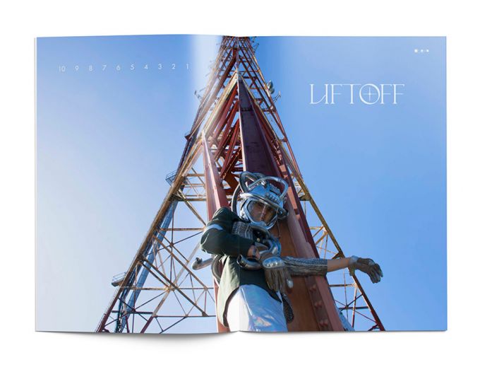 An inside spread in Space Odyssey magazine featuring an astronaut in gear and the launch structure with the word Liftoff in white.