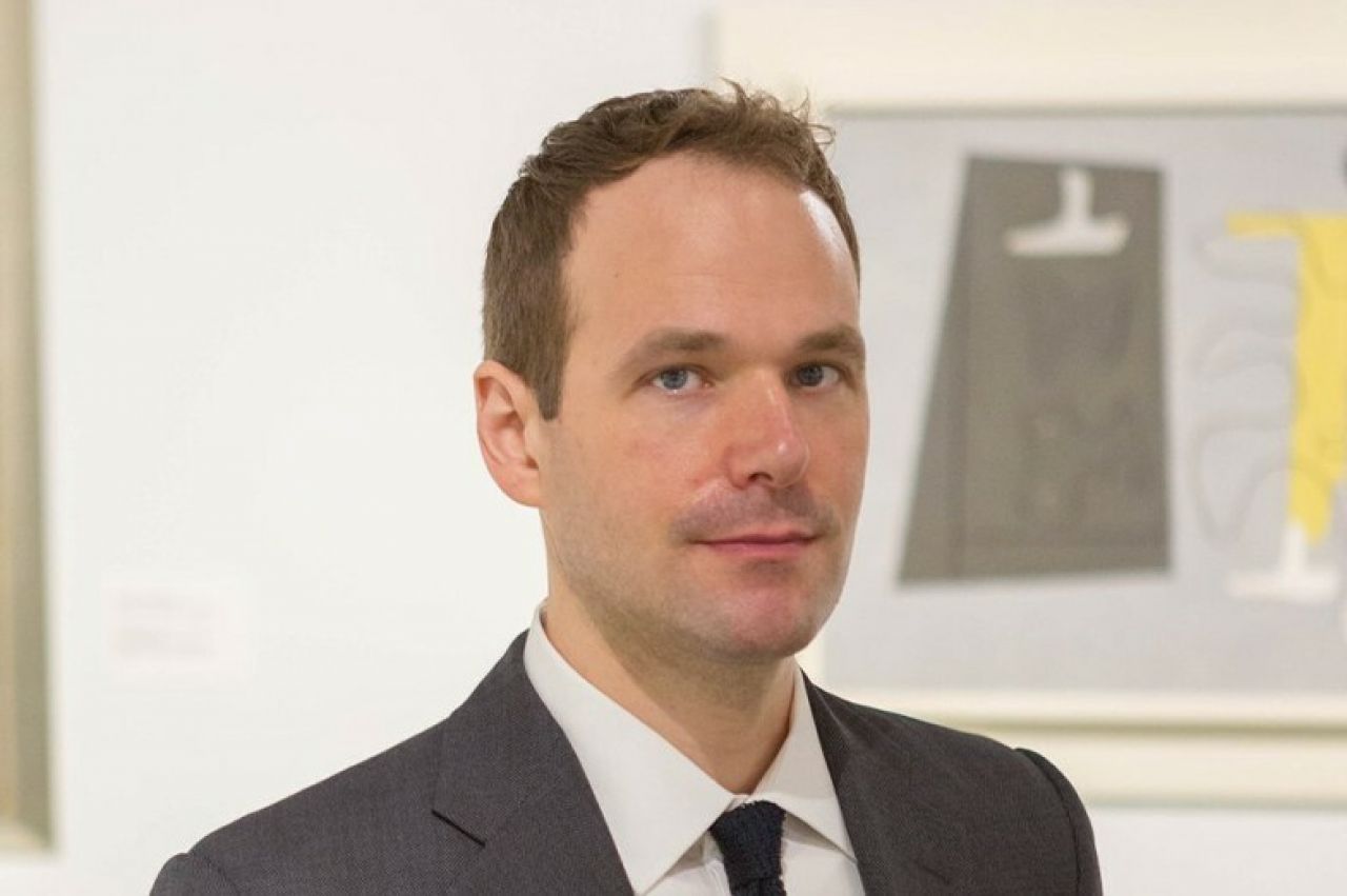 Head shot curator Adam Thomas