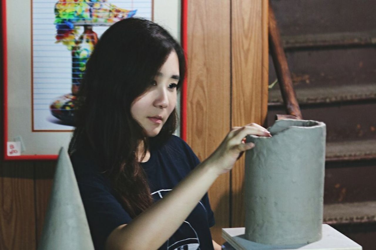 Audrey An working in basement studio