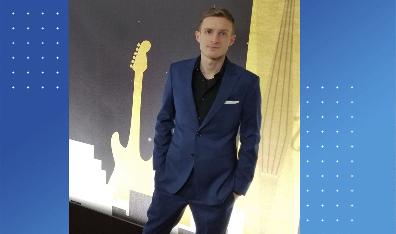 Image of a young man in a suit