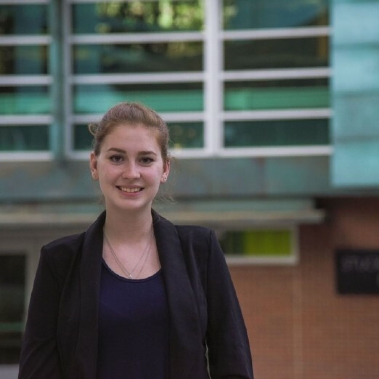 Holly Zimmerman in front of the Stuckeman Family Building