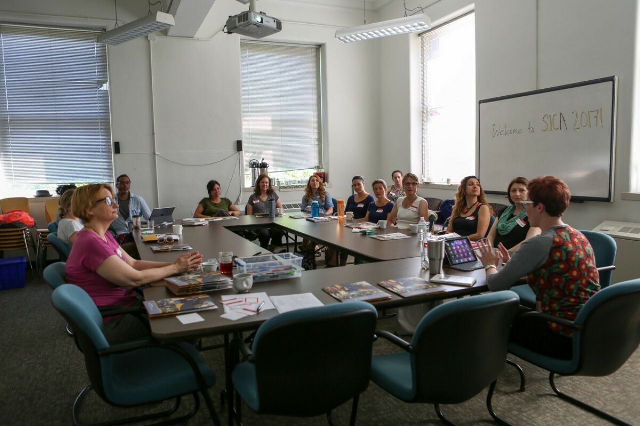 Teachers sitting around a table