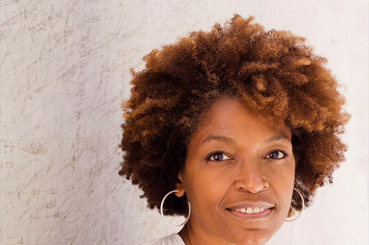 Portrait of Yolande Daniels against a white background