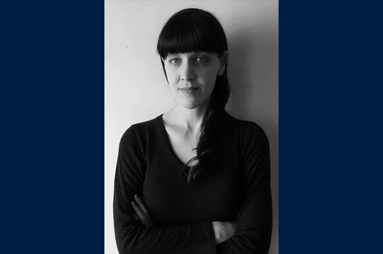 Black and white headshot of Tess Clancy