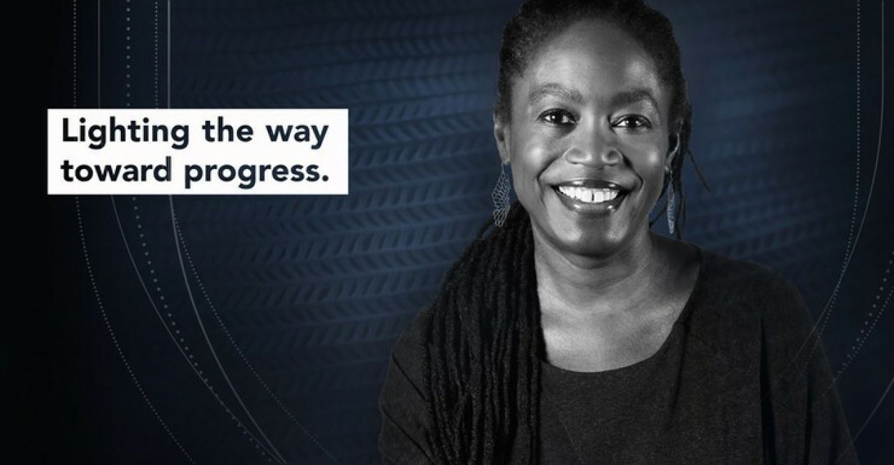 An image of Felicia Davis with a block caption to the left of her stating Lighting the way toward progress.