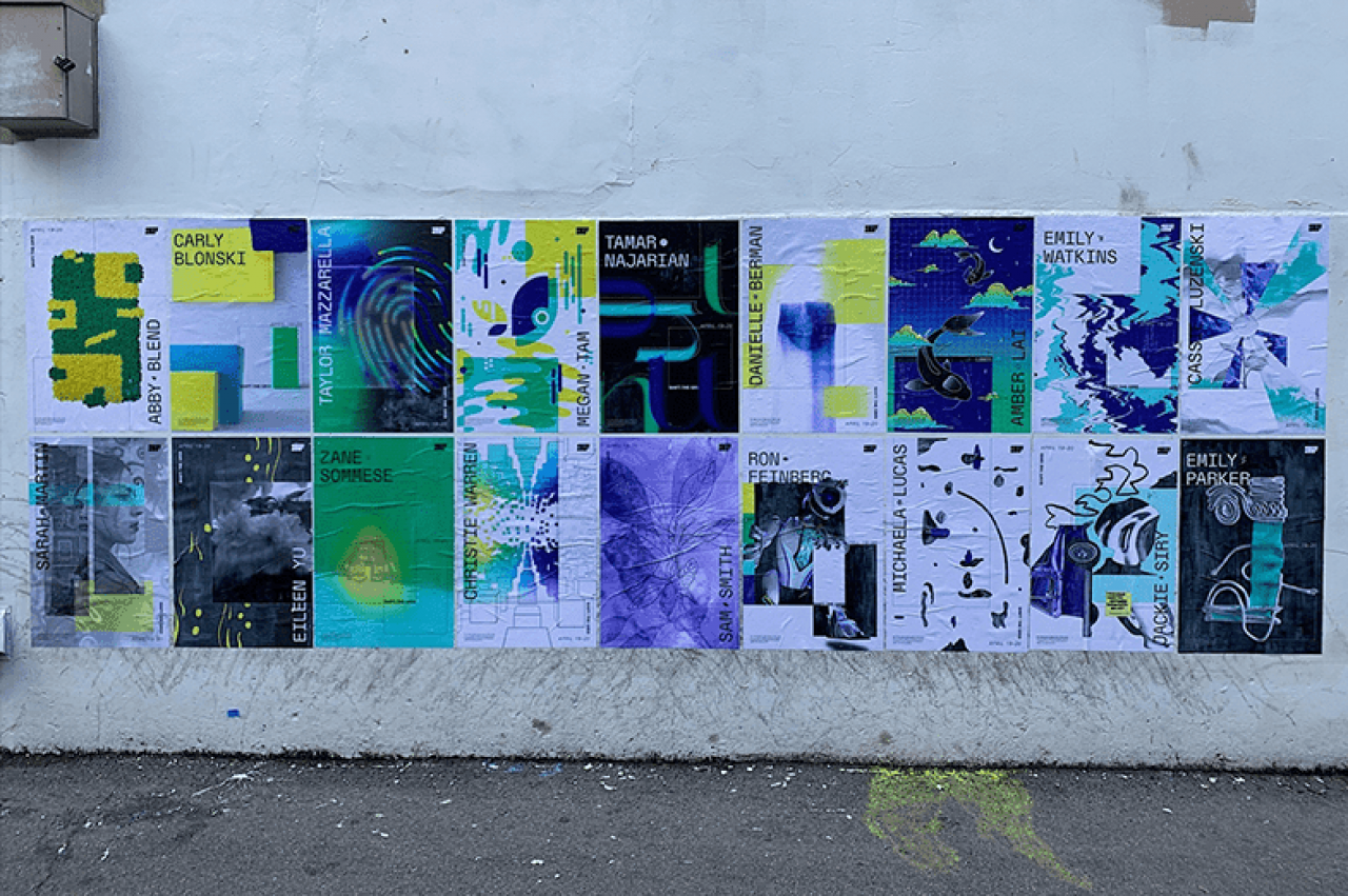 The poster exhibit fourth-year graphic design students installed as part of their senior showcase on the back of the State Theatre on Calder Way in downtown State College.